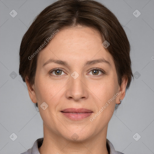 Joyful white adult female with short  brown hair and grey eyes