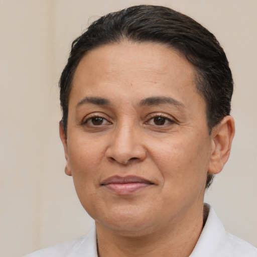 Joyful white adult female with short  brown hair and brown eyes