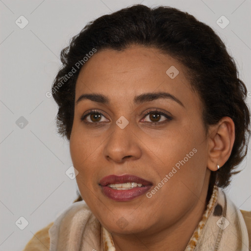 Joyful latino adult female with short  brown hair and brown eyes