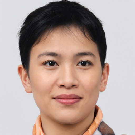 Joyful asian young-adult female with short  brown hair and brown eyes