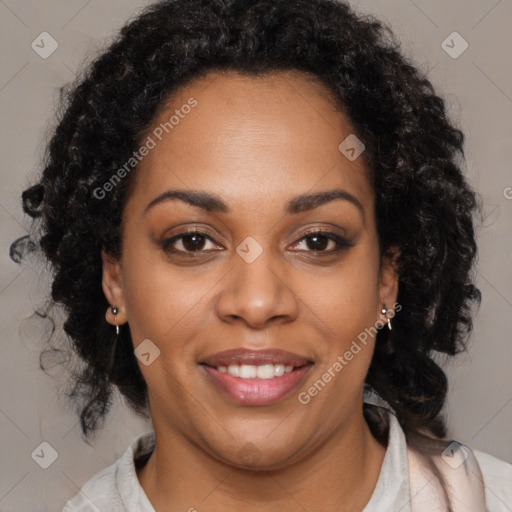 Joyful black young-adult female with long  black hair and brown eyes