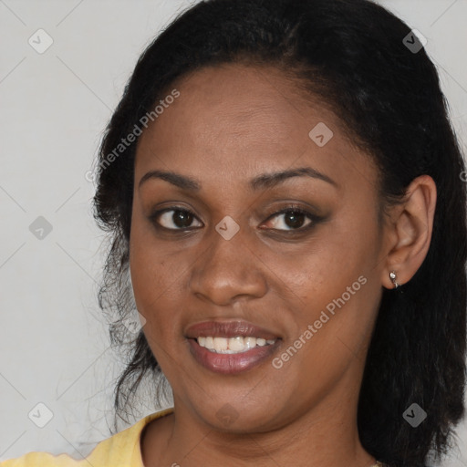 Joyful black young-adult female with long  brown hair and brown eyes