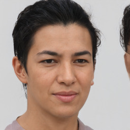 Joyful asian young-adult male with short  brown hair and brown eyes