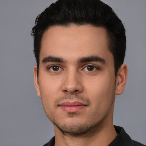 Neutral white young-adult male with short  black hair and brown eyes