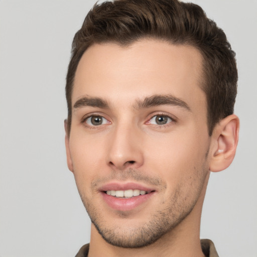 Joyful white young-adult male with short  brown hair and brown eyes