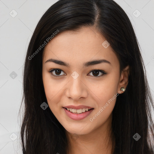 Joyful asian young-adult female with long  brown hair and brown eyes