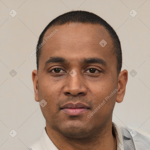 Neutral latino young-adult male with short  black hair and brown eyes