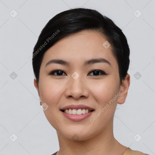 Joyful asian young-adult female with short  black hair and brown eyes