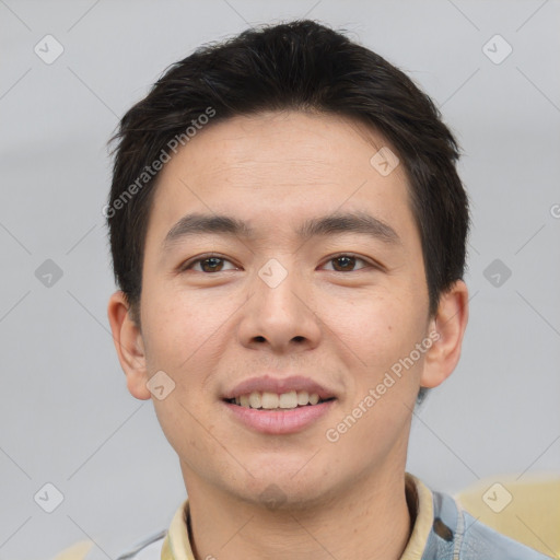 Joyful asian young-adult male with short  brown hair and brown eyes