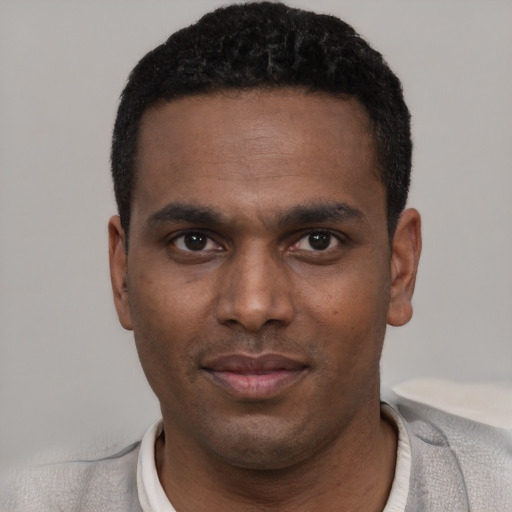 Neutral black young-adult male with short  black hair and brown eyes
