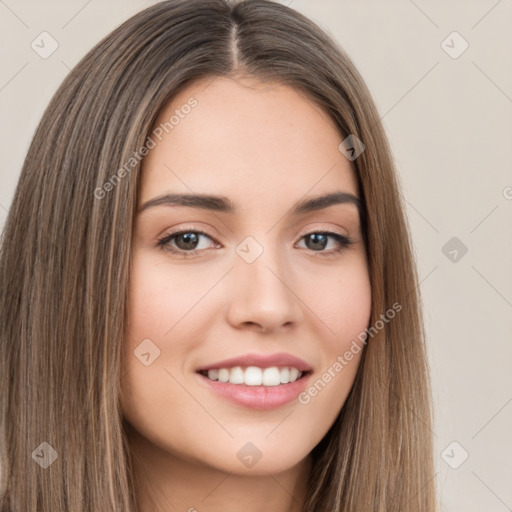 Joyful white young-adult female with long  brown hair and brown eyes