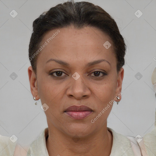 Joyful black adult female with short  brown hair and brown eyes