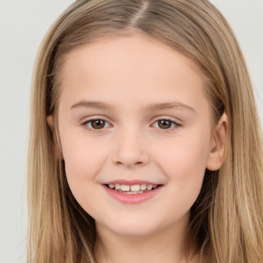 Joyful white child female with long  brown hair and brown eyes