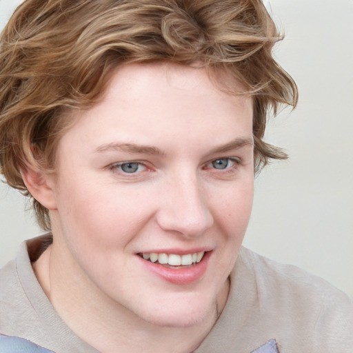 Joyful white young-adult female with medium  brown hair and blue eyes