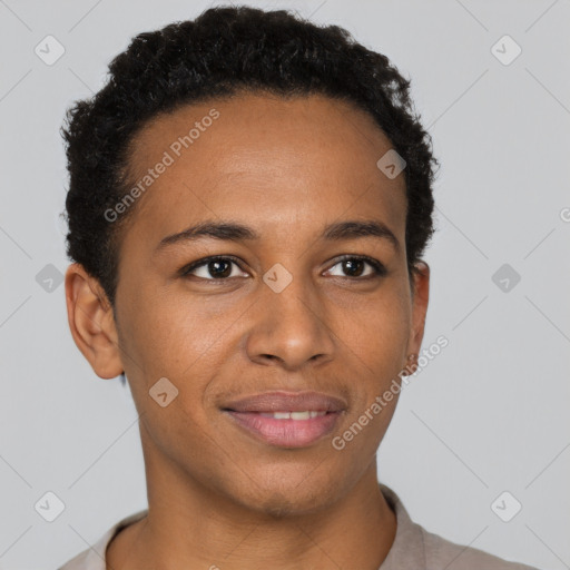 Joyful black young-adult male with short  brown hair and brown eyes