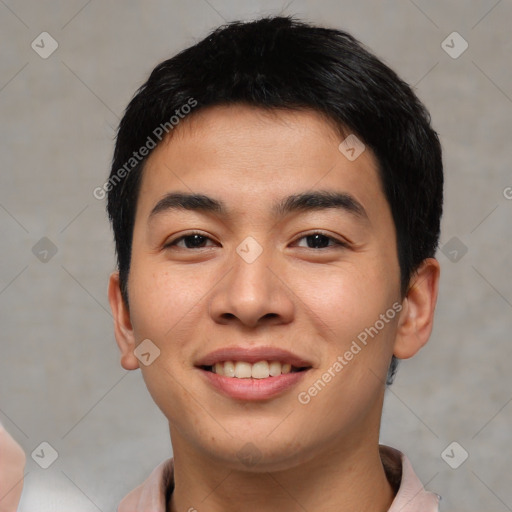 Joyful asian young-adult male with short  brown hair and brown eyes