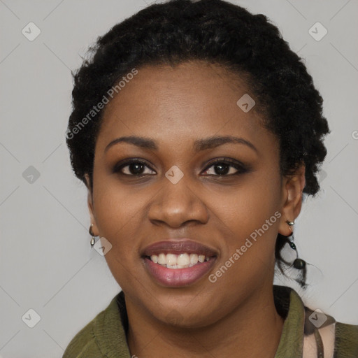 Joyful black young-adult female with short  black hair and brown eyes