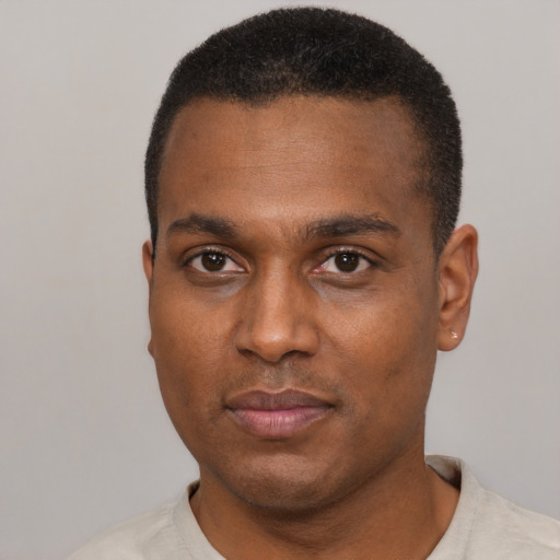 Neutral black young-adult male with short  black hair and brown eyes
