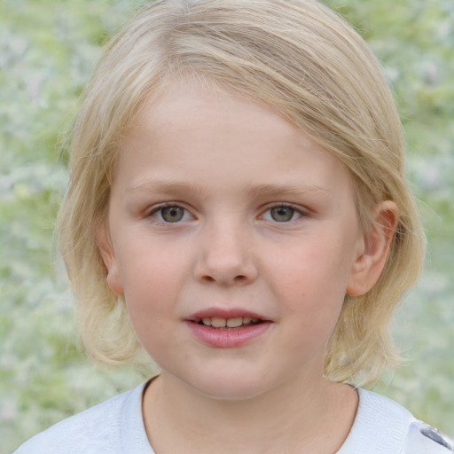 Joyful white child female with medium  blond hair and blue eyes