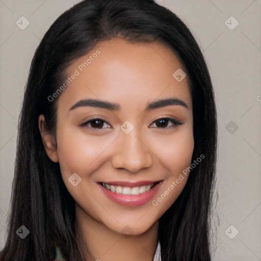 Joyful latino young-adult female with long  black hair and brown eyes