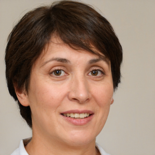 Joyful white adult female with medium  brown hair and brown eyes