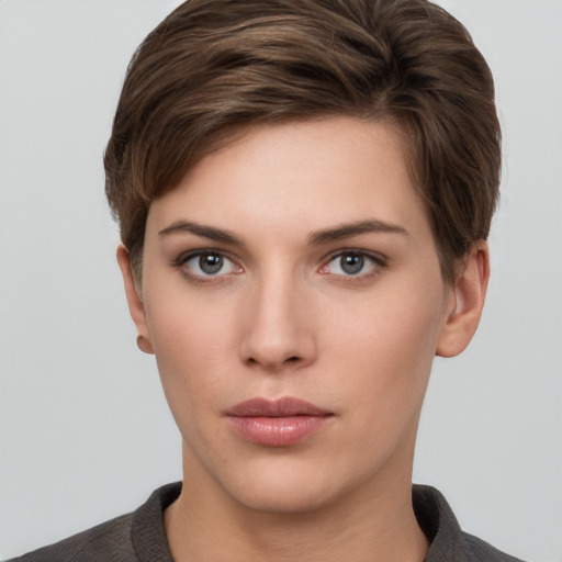 Neutral white young-adult female with short  brown hair and brown eyes