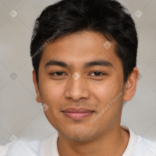 Joyful asian young-adult male with short  brown hair and brown eyes