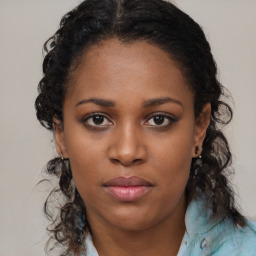 Joyful black young-adult female with medium  brown hair and brown eyes