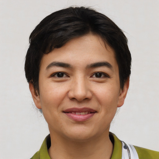 Joyful asian young-adult female with short  black hair and brown eyes