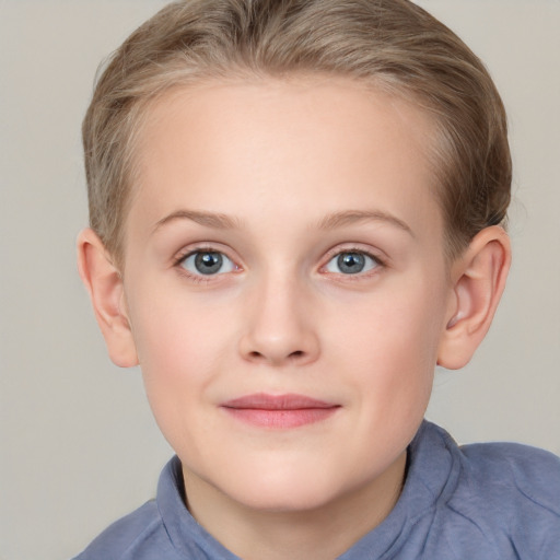 Joyful white child female with short  brown hair and blue eyes