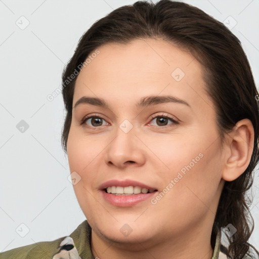 Joyful white young-adult female with medium  brown hair and brown eyes