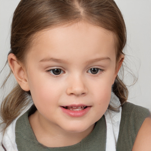 Joyful white child female with medium  brown hair and brown eyes