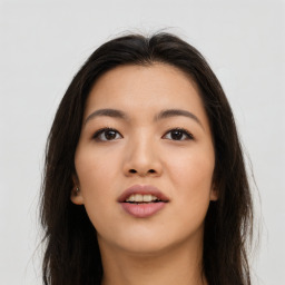 Joyful asian young-adult female with long  brown hair and brown eyes