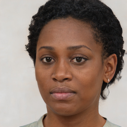 Neutral black young-adult female with short  brown hair and brown eyes