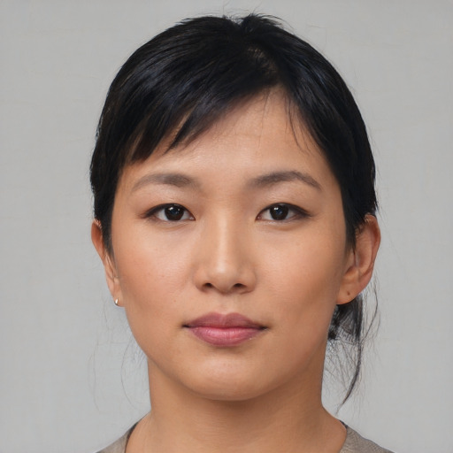 Neutral asian young-adult female with medium  black hair and brown eyes
