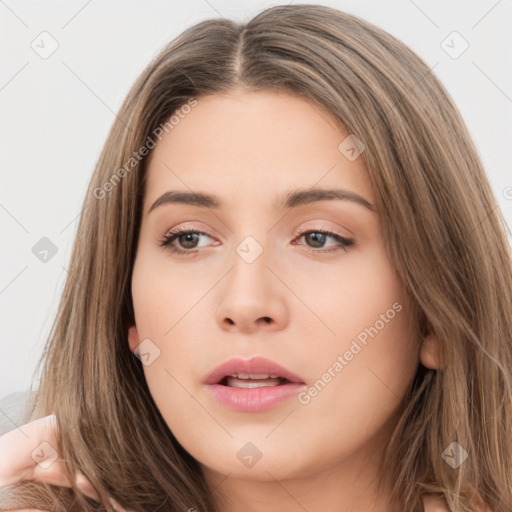 Neutral white young-adult female with long  brown hair and brown eyes