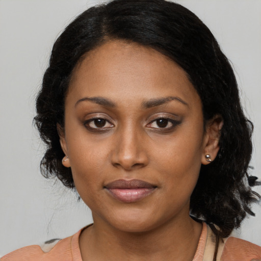 Joyful latino young-adult female with medium  black hair and brown eyes