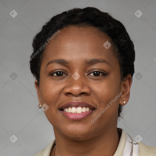 Joyful black young-adult female with short  black hair and brown eyes