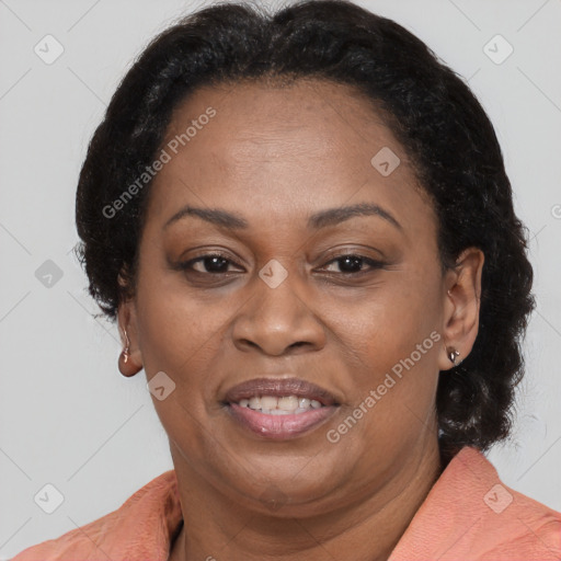 Joyful latino adult female with medium  brown hair and brown eyes