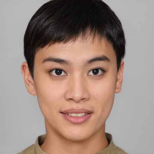 Joyful asian young-adult male with short  brown hair and brown eyes