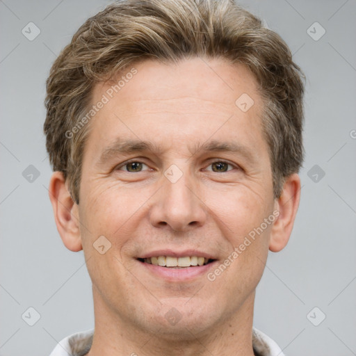 Joyful white adult male with short  brown hair and grey eyes