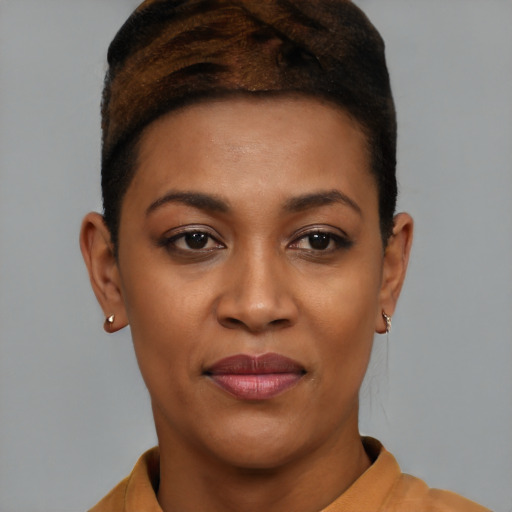 Joyful latino young-adult female with short  black hair and brown eyes