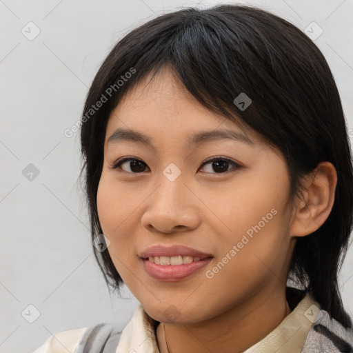 Joyful asian young-adult female with medium  brown hair and brown eyes