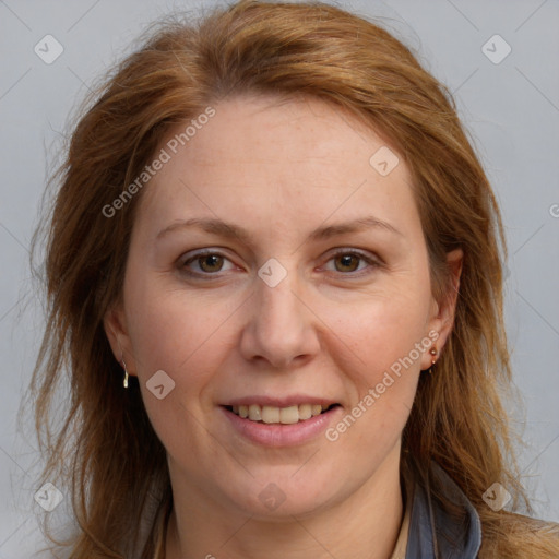 Joyful white adult female with long  brown hair and brown eyes