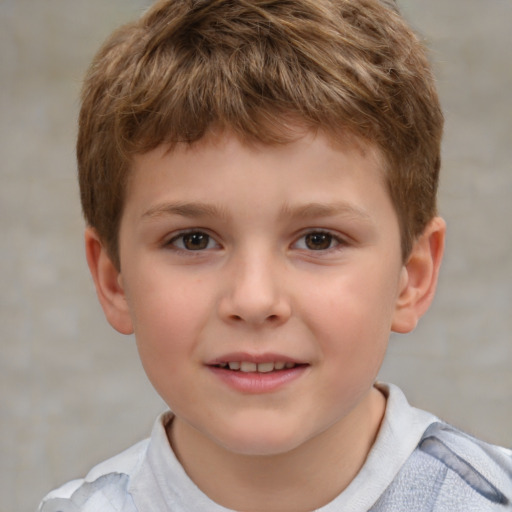 Joyful white child male with short  brown hair and brown eyes