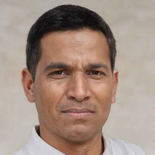 Neutral asian adult male with short  black hair and brown eyes