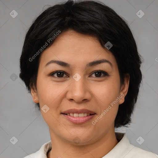 Joyful asian adult female with medium  brown hair and brown eyes