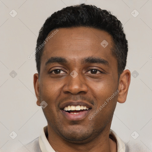 Joyful black young-adult male with short  black hair and brown eyes