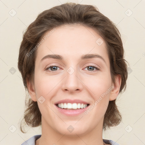 Joyful white young-adult female with medium  brown hair and green eyes