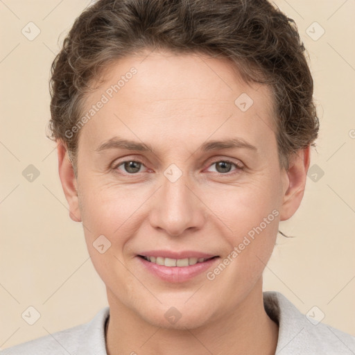 Joyful white adult female with short  brown hair and brown eyes